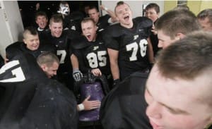 The Perrysburg football team brings the Ding Dong Bell back to their locker room in 2015 after beating Maumee 55-26. THE BLADE/KATIE RAUSCH