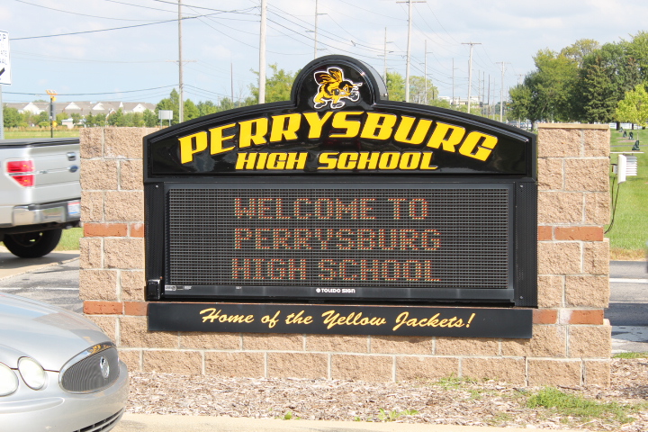 Sign reads Perrysburg High School, Welcome to Perrysburg High School, Home of the Yellow Jackets