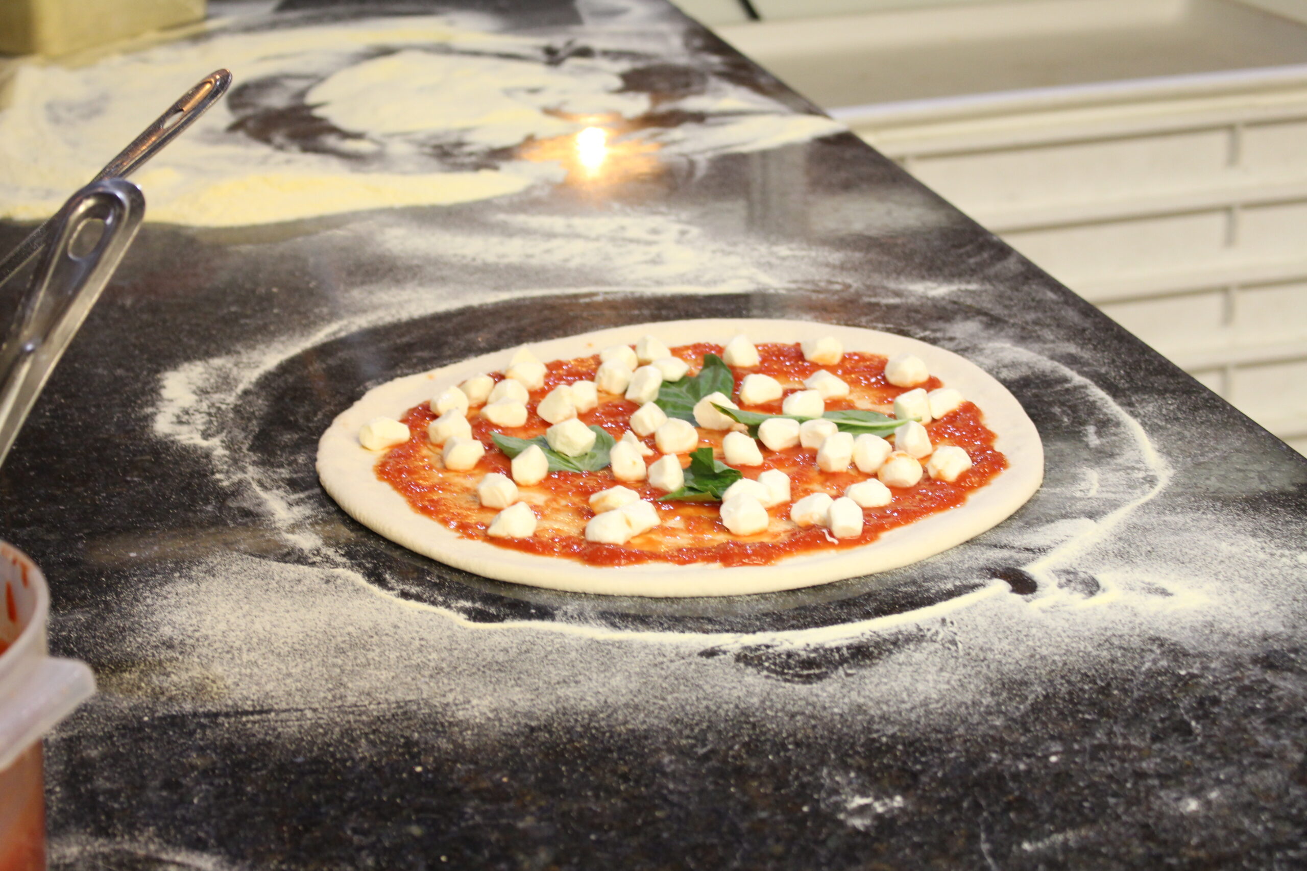 A Margherita pizza ready to be put in the oven